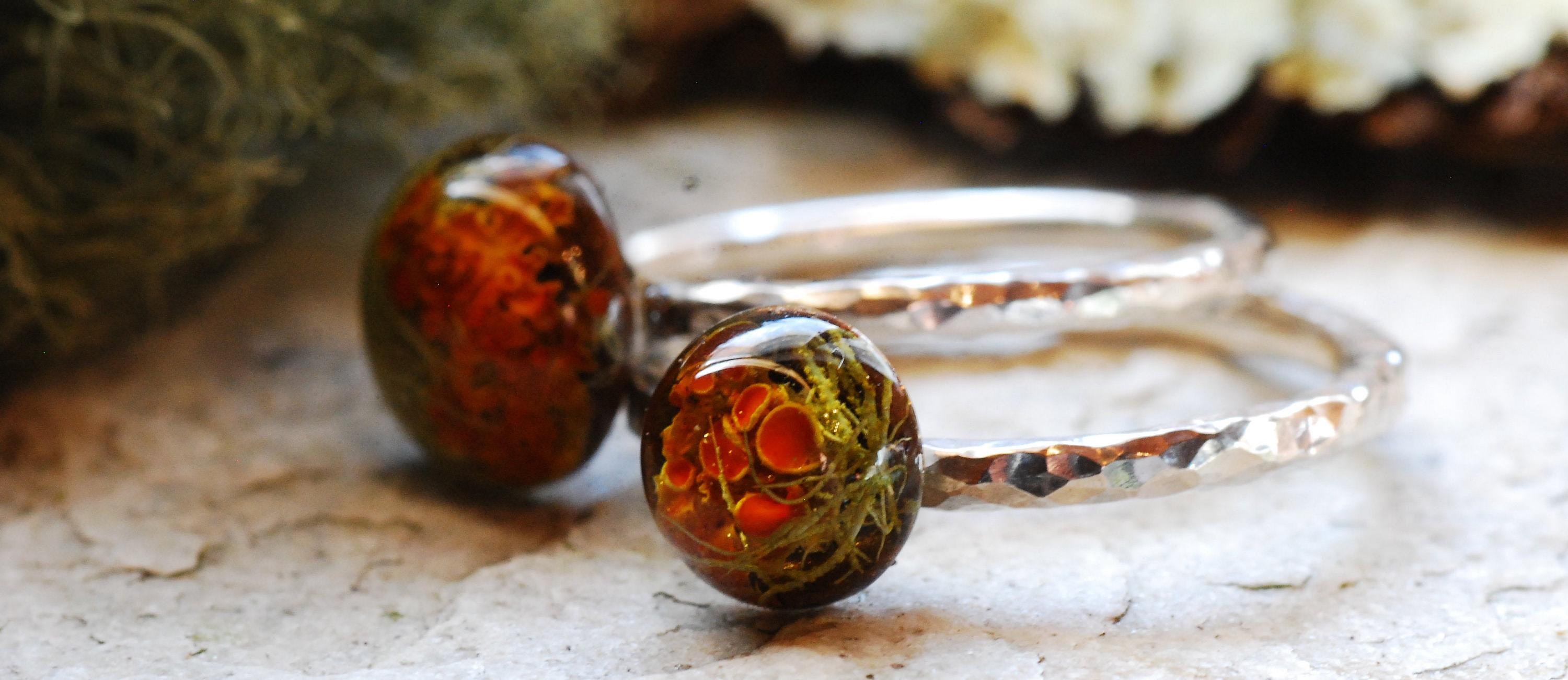banner hammered sterling silver ring with rich orange lichen and moss cabochon