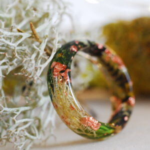 side view on resin ring made with green moss and lichens