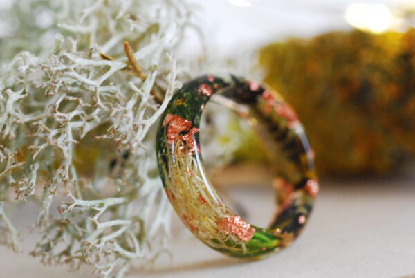 side view on resin ring made with green moss and lichens