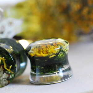 Resin ear plugs made with orange lichen and green moss