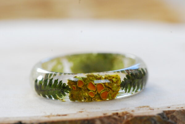 front look at Orange lichen and ferns natural ring with leaves and beard lichen