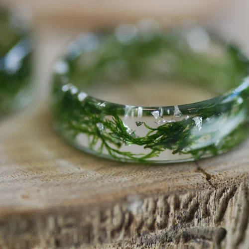 close up of nature lovers green moss resin ring