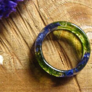 top view of green moss and blue cornflower ring
