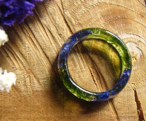 top view of green moss and blue cornflower ring