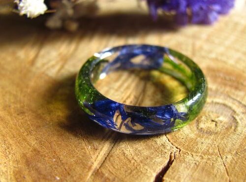 Fairy blue pressed flowers with green moss in crystal resin ring