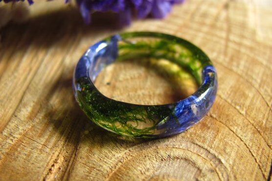 Fairy blue pressed flowers with green moss in crystal resin ring