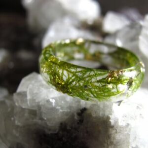 resin ring made with green moss and gold flakes