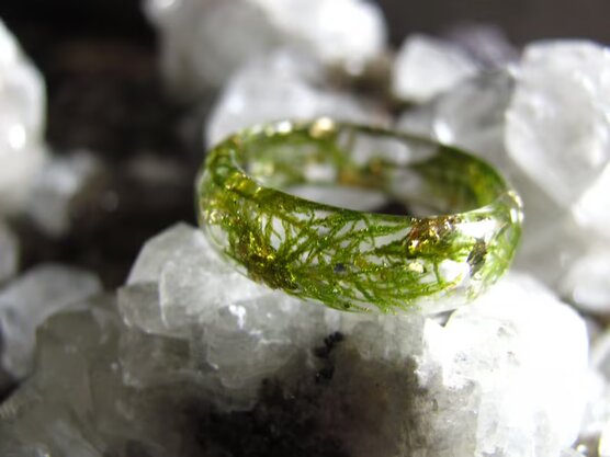 resin ring made with green moss and gold flakes