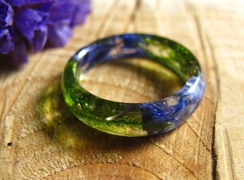 Fairy blue pressed flowers with green moss in crystal resin ring