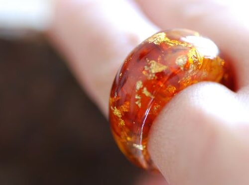 flamboyant real baltic amber and 24k gold flakes ring on finger