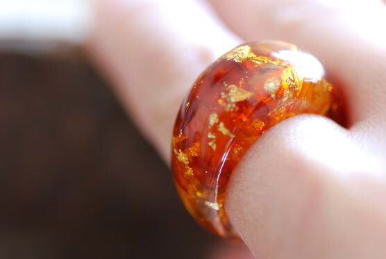 flamboyant real baltic amber and 24k gold flakes ring on finger