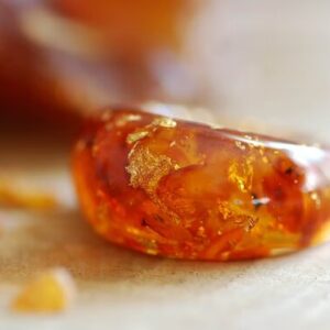 Statement and bold amber baltic ring with real 24k gold flakes in orange dyed resin.