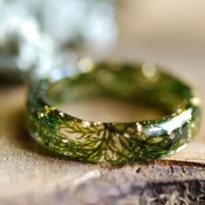foresty ring full of moss and gold flakes