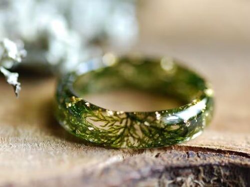 foresty ring full of moss and gold flakes