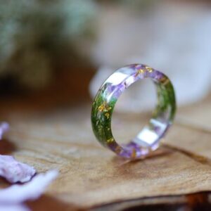 resin ring made with amethyst moss and gold flakes