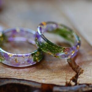 Resin ring made with amythust moss and gold flakes