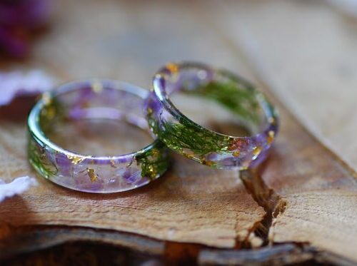 Resin ring made with amythust moss and gold flakes