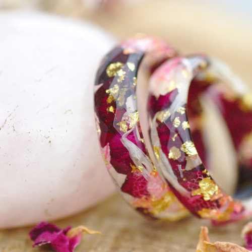 two red rose 24k gold flakes and white cornflower resin rings