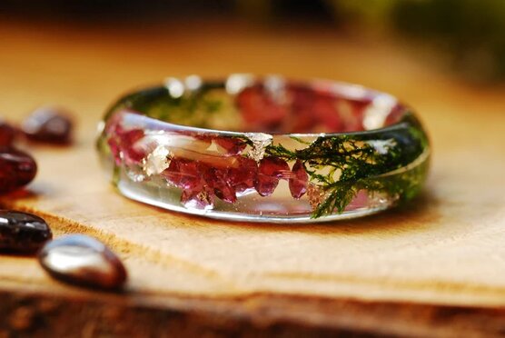 garnet moss and gold flakes resin ring close up