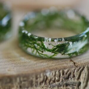 close up of nature lovers green moss resin ring
