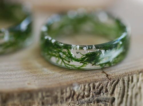 close up of nature lovers green moss resin ring