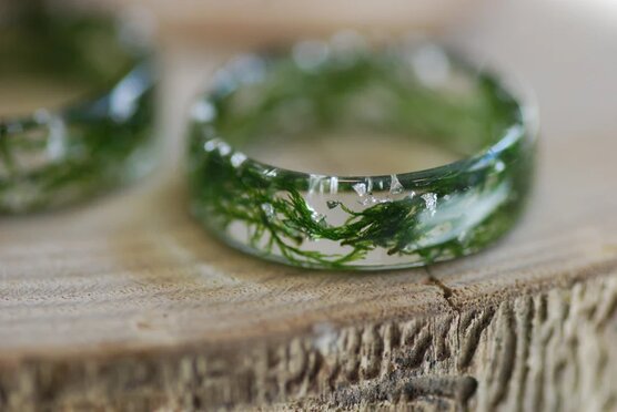 close up of nature lovers green moss resin ring