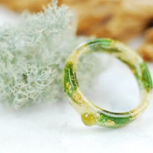 green peridot stones jasmine petals and gold flakes resin ring