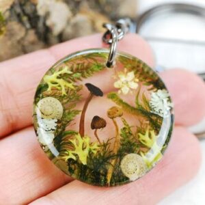 beautiful forest scape keychain with moss flowers liken and tiny mushrooms