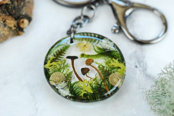 Fairy forest landscape with mushrooms and fern key ring