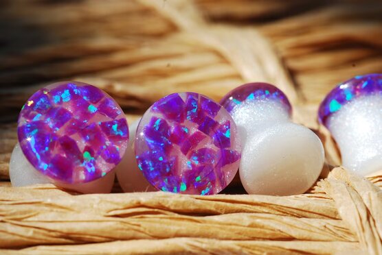 Purple opal iridescent ear gauges made of white resin and lab opal on top