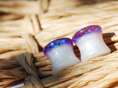 Purple opal iridescent ear gauges made of white resin and lab opal on top 