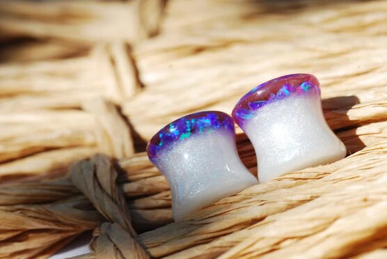 Purple opal iridescent ear gauges made of white resin and lab opal on top