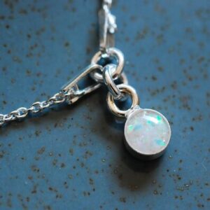 Silver bracelet with lab white opal charm