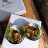 totally unique ear gauges with mushrooms moss and lichen
