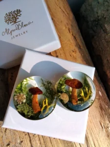 totally unique ear plugs with mushrooms moss and lichen