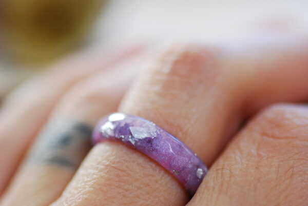 purple pastel resin ring on finger