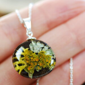 hand holding fairy forest lichen necklace
