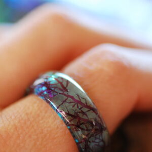marmaid blue ring on finger