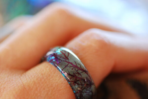 marmaid blue ring on finger