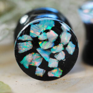 iridescent white opal gauges on dark background