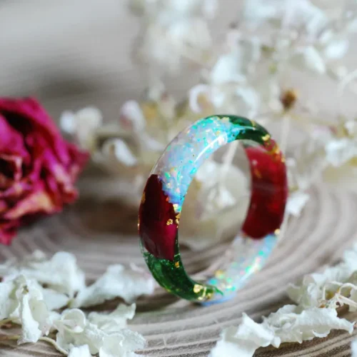 Ring made of resin with pink or white opal, green moss, red roses and gold flakes