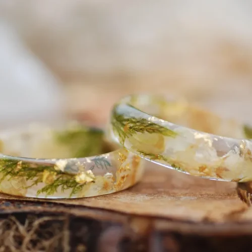 Pressed flower ring made with jasmine and baby's breath flowers , green moss and gold flakes set in clear resin