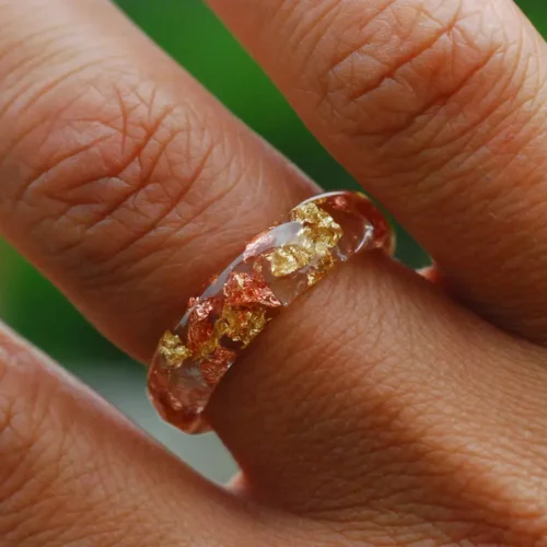 gold copper ring on finger