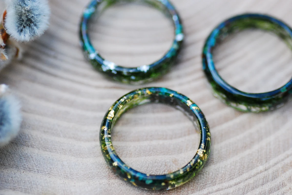 Earthy ring made of chrysocolla and jade gemstones with green moss and metallic flakes