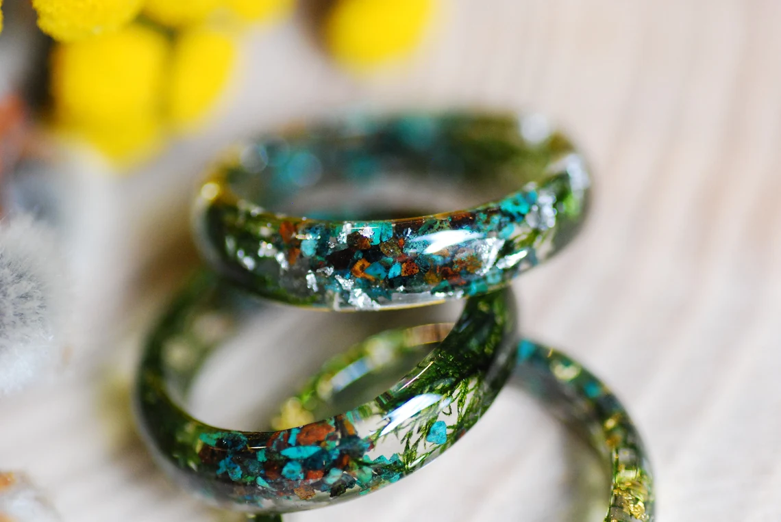 Earthy ring made of chrysocolla and jade gemstones with green moss and metallic flakes