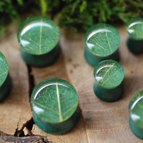 earring gauges looking like green lead