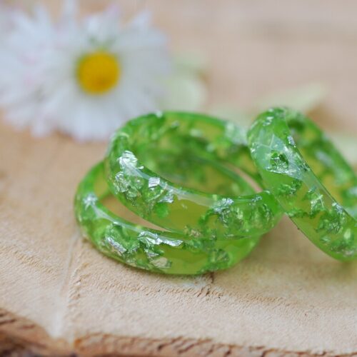 three minimalist light green rings