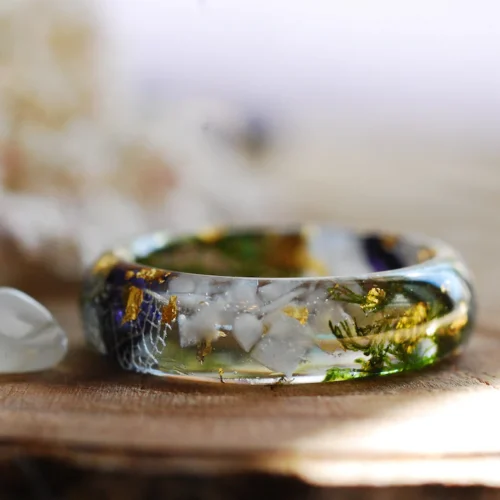 beautiful ring made with moonstone deep red mallows and green moss