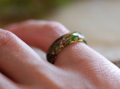 nature ring with green moss and copper on finger