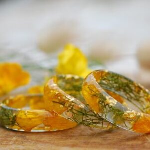 summer ring made with yellow buttercap and moss
